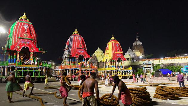 Workers preparing to pull the three chariots of Lord Jagannath and his two siblings —Balabhadra and Subhadra(PTI)