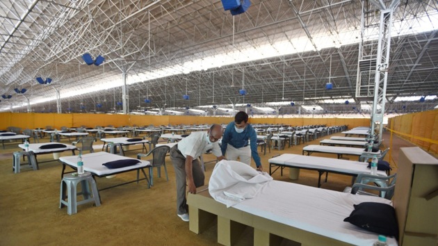 Volunteers working to prepare the world’s largest Covid 19 care facility with 10,000 beds at the Radha Soami Satsang Beas center, Chhatarpur,in New Delhi on Wednesday. The facility will be operational by June 26. (Ajay Aggarwal/HT PHOTO) Volunteers working to prepare the world’s largest Covid 19 care facility with 10,000 beds at the Radha Soami Satsang Beas center, Chhatarpur,in New Delhi on Wednesday. The facility will be operational by June 26. (Ajay Aggarwal/HT PHOTO)