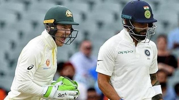 Australia's captain Tim Paine (L) celebrates as India's captain Virat Kohli leaves the field after being dismissed on day three of the first test match between Australia and India at the Adelaide Oval in Adelaide, Australia, December 8, 2018.(REUTERS)