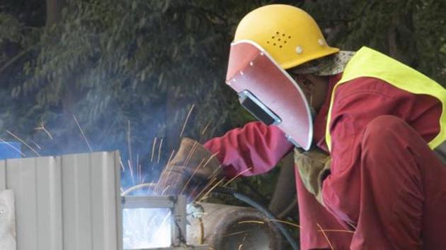 A worker performs welding works on a bridge in Beijing.(AP Photo)