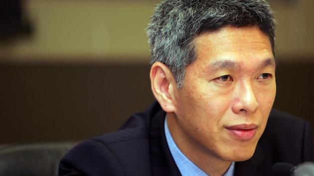 Lee Hsien Yang answers questions during a news conference in Singapore. (REUTERS)