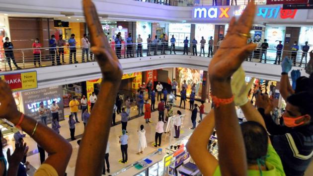 Lake Mall authorities applaud customers, staff, and retailers for their cooperation during the nationwide lockdown, in Kolkata on June 22. When India reported only 500 cases on March 25, the country went into what was one of the strictest lockdowns in the world. This first set of curbs remained in place till April 14 and was extended four times, each with gradual relaxations. (PTI) Lake Mall authorities applaud customers, staff, and retailers for their cooperation during the nationwide lockdown, in Kolkata on June 22. When India reported only 500 cases on March 25, the country went into what was one of the strictest lockdowns in the world. This first set of curbs remained in place till April 14 and was extended four times, each with gradual relaxations. (PTI)