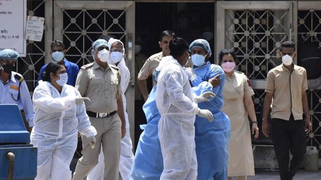 File photo: CATS ambulance staff in PPE suits and doctors of LNJP Hospital in New Delhi. (Sonu Mehta/HT PHOTO) File photo: CATS ambulance staff in PPE suits and doctors of LNJP Hospital in New Delhi. (Sonu Mehta/HT PHOTO)