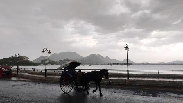A horsecart is seen in the backdrop of Anna Sagar Lake with dark monsoon clouds in the sky, in Ajmer , Rajasthan.(ANI) A horsecart is seen in the backdrop of Anna Sagar Lake with dark monsoon clouds in the sky, in Ajmer , Rajasthan.(ANI)
