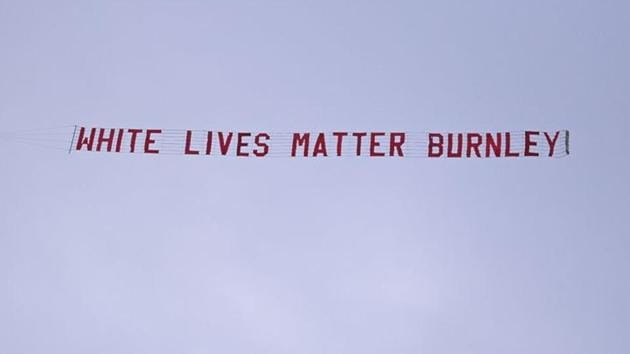 Soccer Football - Premier League - Manchester City v Burnley - Etihad Stadium, Manchester, Britain - June 22, 2020 A "White Lives Matter Burnley" banner is seen tied to a plane above the stadium.(REUTERS)