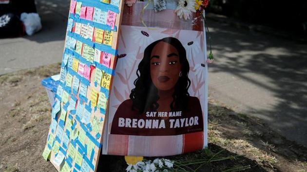 A portrait of Breonna Taylor is posted to a pole beside messages on sticky notes as protesters establish what they call an autonomous zone while continuing to protest against racial inequality and call for a defunding of Seattle police, in Seattle, Washington, US.(REUTERS) A portrait of Breonna Taylor is posted to a pole beside messages on sticky notes as protesters establish what they call an autonomous zone while continuing to protest against racial inequality and call for a defunding of Seattle police, in Seattle, Washington, US.(REUTERS)