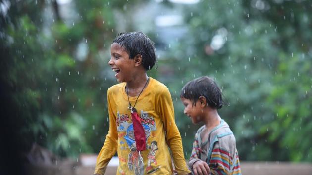 Children rejoice during rain showers at Madhu Vihar in New Delhi on June 24. The rains will bring with them much sought relief in the national capital region from the scorching summer heat. (Raj K Raj / HT Photo)