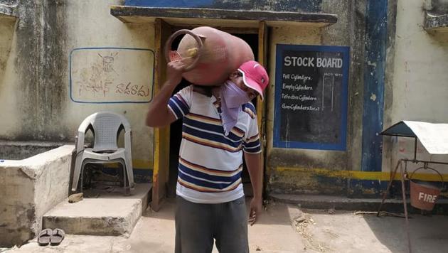 Zaheer Ahed Sheik who lost his job as a teacher in Hyderabad now works as a labourer in a gas agency in Telangana’s Mancherial district .(HT PHOTO)