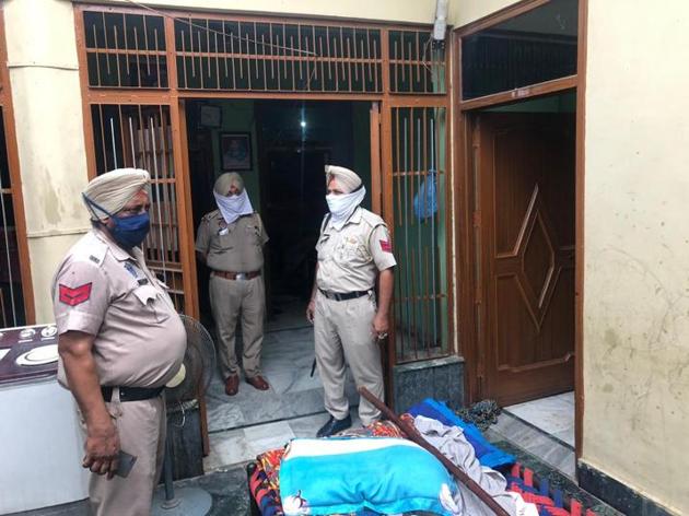 A police team at the house where four family members and their driver were hacked to death at Kairon village of Patti sub division of Tarn Taran district on Thursday. (HT Photo) A police team at the house where four family members and their driver were hacked to death at Kairon village of Patti sub division of Tarn Taran district on Thursday. (HT Photo)