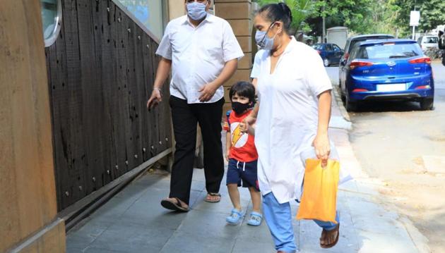 Taimur with Saif and Kareena’s staff members.