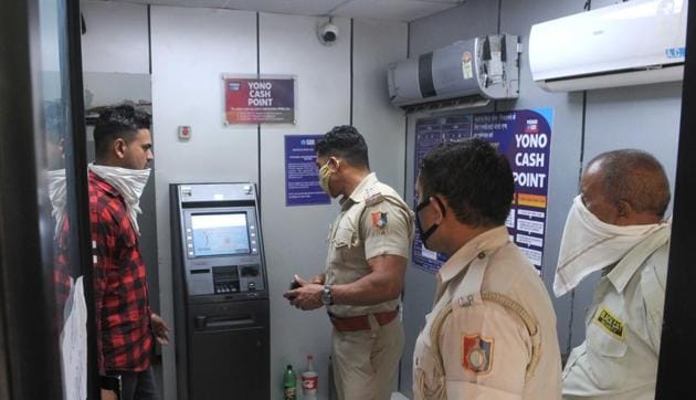 Cops investigating at the crime spot in Sector 44, Chandigarh, on Thursday. (Keshav Singh/HT)