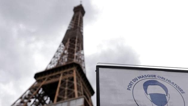 A sign that reads, "Mandatory to wear a mask on all the site", is seen at the entrance of the Eiffel Tower as she gets ready to re-open to the public following the coronavirus outbreak, in Paris, France, June 17, 2020.(REUTERS)