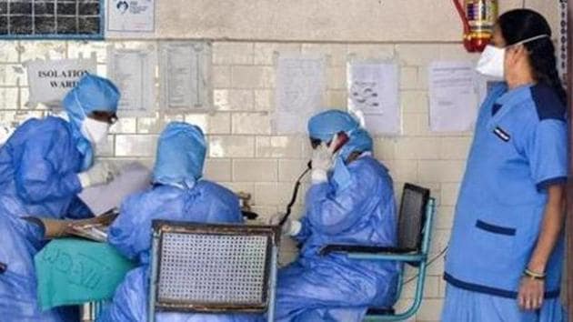 File photo: Medics outside an isolation ward of the coronavirus at a hospital.(PTI)