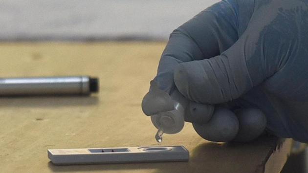 A medical professional pours a sample into a COVID-19 Ag antigen test kit well at a government school in Bapa Nagar, New Delhi. According to a PTI report, for the last six days, Delhi has recorded 3,402 cases on an average daily. Active cases in the national capital currently stand at 26,588. (Sonu Mehta / HT Photo) A medical professional pours a sample into a COVID-19 Ag antigen test kit well at a government school in Bapa Nagar, New Delhi. According to a PTI report, for the last six days, Delhi has recorded 3,402 cases on an average daily. Active cases in the national capital currently stand at 26,588. (Sonu Mehta / HT Photo)