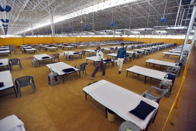 Rows of beds in a section of the Radha Soami Satsang Beas sect’s Chhatarpur facility which is set to be India’s biggest Covid-19 care centre. A 2,000 bed section is expected to be ready today with the facility fully functional by the first week of July. (Ajay Aggarwal /HT Photo) Rows of beds in a section of the Radha Soami Satsang Beas sect’s Chhatarpur facility which is set to be India’s biggest Covid-19 care centre. A 2,000 bed section is expected to be ready today with the facility fully functional by the first week of July. (Ajay Aggarwal /HT Photo)