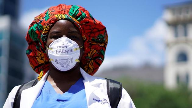 A health worker wearing a face mask with the words "I can't breathe" attends a protest against racial inequality in the aftermath of the death in Minneapolis police custody of George Floyd, in New York City, New York, US. (REUTERS) A health worker wearing a face mask with the words "I can't breathe" attends a protest against racial inequality in the aftermath of the death in Minneapolis police custody of George Floyd, in New York City, New York, US. (REUTERS)