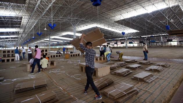 Workers assemble cardboard beds at the Radha Soami Satsang Beas Covid-19 facility in New Delhi on June 24. This Covid-19 care centre has been split into 116 separate sections of 88 beds each taking its total capacity to 10,208 beds. Of these 10% will be equipped with oxygen facilities. (Ajay Aggarwal /HT PHOTO) Workers assemble cardboard beds at the Radha Soami Satsang Beas Covid-19 facility in New Delhi on June 24. This Covid-19 care centre has been split into 116 separate sections of 88 beds each taking its total capacity to 10,208 beds. Of these 10% will be equipped with oxygen facilities. (Ajay Aggarwal /HT PHOTO)