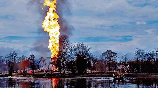 Army personnel help douse the fire after a blowout in a gas well of Oil India Limited at Baghjan, Tinsukia district on Tuesday.(ANI photo)