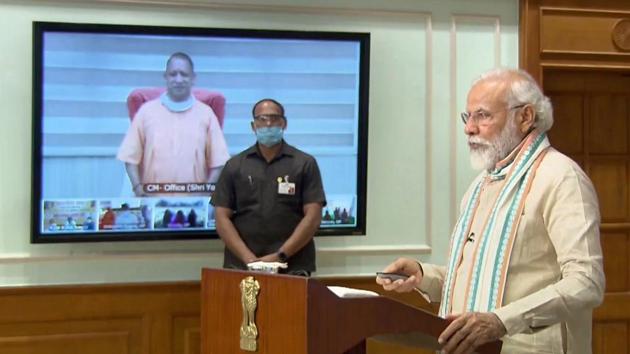 Prime Minister Narendra Modi launches the Atma Nirbhar Uttar Pradesh Rojgar Abhiyaan, to provide employment to migrant workers and those who lost work due to coronavirus lockdown, through video-conference in the presence of Chief Minister Yogi Adityanath, in New Delhi. (PTI) Prime Minister Narendra Modi launches the Atma Nirbhar Uttar Pradesh Rojgar Abhiyaan, to provide employment to migrant workers and those who lost work due to coronavirus lockdown, through video-conference in the presence of Chief Minister Yogi Adityanath, in New Delhi. (PTI)