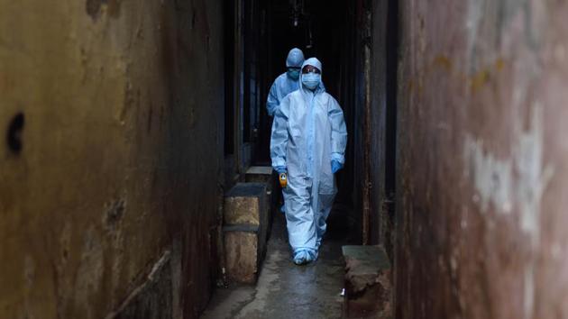 Medical professionals head to conduct door-to-door screening of residents living in Dharavi, Mumbai. With just five cases reported on June 23, and less than 35 cases per day reported throughout June, experts believe Dharavi has flattened the curve, and now likely to show signs of dipping. (Satish Bate / HT Photo)