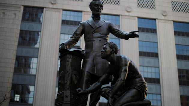 The Emancipation Memorial, a statue depicting US President Abraham Lincoln standing over a freed slave that has become controversial for some activists during protests against racial inequality in the aftermath of the death in Minneapolis police custody of George Floyd, stands in Boston, Massachusetts, US.(REUTERS)