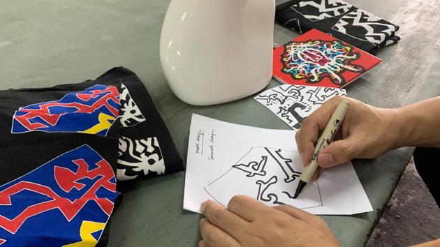 Malaysian textile and fashion designer Mohd Hafiz Drahman sketches a mask design based on traditional patterns at a studio, amid the coronavirus disease (COVID-19) outbreak in Shah Alam, Malaysia June 23, 2020. (REUTERS)