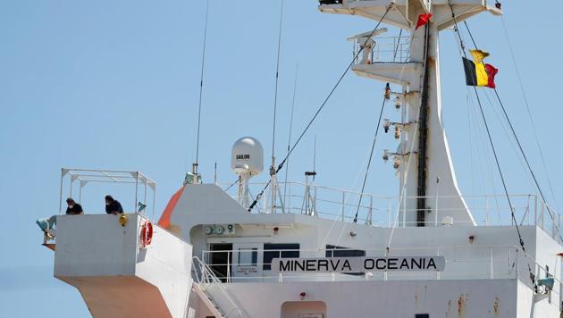 Minerva Oceania crew members wearing protective masks stand on the deck of the Maltese-flagged oil tanker after more than half of its crew tested positive for a coronavirus disease (Covid-19) at the Belgian port of Antwerp, Belgium on June 25, 2020. (Reuters Photo) Minerva Oceania crew members wearing protective masks stand on the deck of the Maltese-flagged oil tanker after more than half of its crew tested positive for a coronavirus disease (Covid-19) at the Belgian port of Antwerp, Belgium on June 25, 2020. (Reuters Photo)