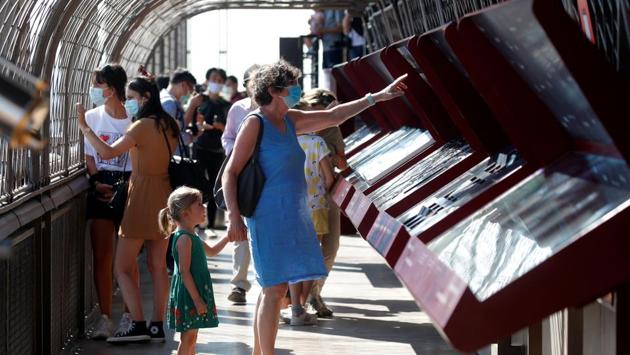 Visitors seen wearing protective face masks at the Eiffel Tower on June 25. Every person over the age of 11 is required to wear a face mask. (Charles Platiau / REUTERS)