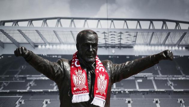 Soccer Football - Liverpool fans celebrate winning the Premier League - Liverpool, Britain - June 26, 2020 A "Champions" scarf is seen on the statue of Bill Shankly after Liverpool were crowned Premier League champions last night after Chelsea won their match against Manchester City Action Images via Reuters/Carl Recine (Action Images via Reuters) Soccer Football - Liverpool fans celebrate winning the Premier League - Liverpool, Britain - June 26, 2020 A "Champions" scarf is seen on the statue of Bill Shankly after Liverpool were crowned Premier League champions last night after Chelsea won their match against Manchester City Action Images via Reuters/Carl Recine (Action Images via Reuters)