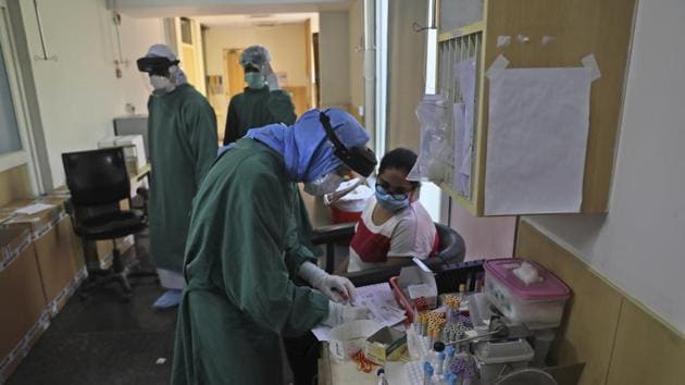 A health worker prepares to take Covid-19 test of a woman at a private hospital, in New Delhi on June 16. (AP File Photo) A health worker prepares to take Covid-19 test of a woman at a private hospital, in New Delhi on June 16. (AP File Photo)