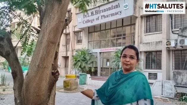 Sarita Khanchandani next to a bird feeder set up at Hiranandani College of Pharmacy, in Ulhasnagar, Maharashtra(HT Photo)