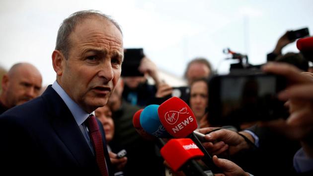 Fianna Fail leader Micheal Martin speaks to media after exit polls were announced in Ireland's national election, in Cork, Ireland.(REUTERS)