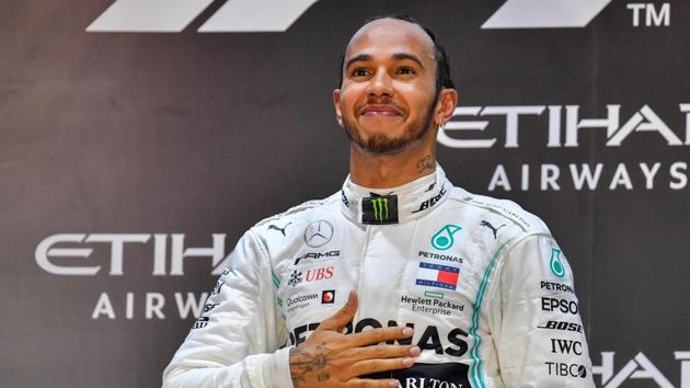 In this file photo taken on December 1, 2019 Mercedes' British driver Lewis Hamilton celebrates his victory(AFP)