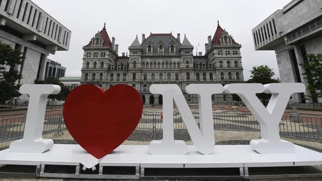 In this Tuesday, June 18, 2019, file photo, a new promotional "I Love NY" sign sits in the Empire State Plaza for installation in front of the New York state Capitol in Albany, N.Y. (AP Photo/Hans Pennink, File) In this Tuesday, June 18, 2019, file photo, a new promotional "I Love NY" sign sits in the Empire State Plaza for installation in front of the New York state Capitol in Albany, N.Y. (AP Photo/Hans Pennink, File)