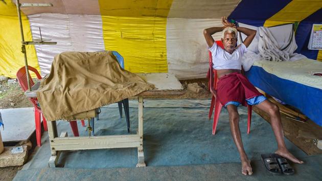 A tailor rests in his tent at the Rambo Circus on June 25. As COVID-19 cases continue to rise, there has been a spurt in cases in Airoli. Nair is making special efforts to ensure that the staff stays within the confines of the camp without mingling with outsiders, reported PTI. (Mitesh Bhuvad / PTI)