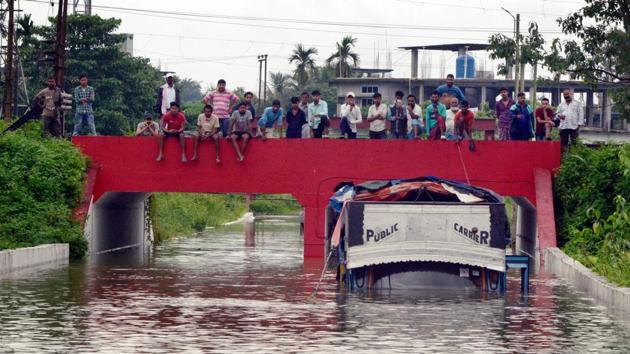 A truck submerged in flood water following heavy rainfall at Banipur in Dibrugarh on June 26. (PTI)