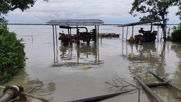 Water pumps installed on banks of Dangori River meant to carry water to fight a gas well fire lie submerged in the flood. (OIL) Water pumps installed on banks of Dangori River meant to carry water to fight a gas well fire lie submerged in the flood. (OIL)