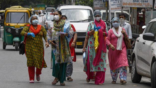 ASHA workers in Karol Bagh's Ragarpura area, on June 26. “The order passed by the Delhi government regarding payment of core incentive is not being implemented at all the dispensaries. We request the government to look into our demand and ensure timely payment of salaries,” said Kavita Yadav, the ASHA state coordinator for AITUC. (Biplov Bhuyan / HT Photo)