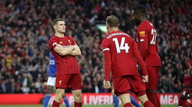 Liverpool's James Milner celebrates scoring their second goal with Jordan Henderson and Divock Origi.(Action Images via Reuters)