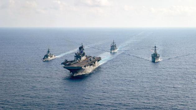 The Royal Australian Navy guided-missile frigate HMAS Parramatta (FFH 154) (L) is underway with the U.S. Navy amphibious assault ship USS America (LHA 6), the Ticonderoga-class guided-missile cruiser USS Bunker Hill (CG 52) and the Arleigh-Burke-class guided-missile destroyer USS Barry (DDG 52) in the South China Sea.(via REUTERS) The Royal Australian Navy guided-missile frigate HMAS Parramatta (FFH 154) (L) is underway with the U.S. Navy amphibious assault ship USS America (LHA 6), the Ticonderoga-class guided-missile cruiser USS Bunker Hill (CG 52) and the Arleigh-Burke-class guided-missile destroyer USS Barry (DDG 52) in the South China Sea.(via REUTERS)