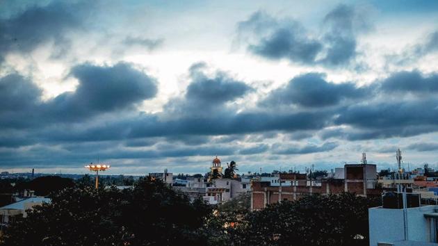 Dark clouds fill the sky over Moorusavir Math in Hubballi on June 27. A good monsoon, which accounts for 70% of India’s annual rainfall, is critical to the fortunes of the agricultural sector, on which at least 700 million people are dependent for a livelihood. (PTI)