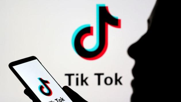 A person holds a smartphone with Tik Tok logo displayed in this picture illustration .(REUTERS)