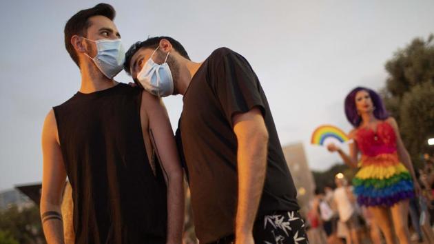 Members of the LGBT community and supporters wear protective face masks attend a pride rally under strict health restrictions due to the coronavirus outbreak in Tel Aviv, Israel on June 28. The rally, like all public observances this year has been downscaled amid the coronavirus outbreak. (AP)