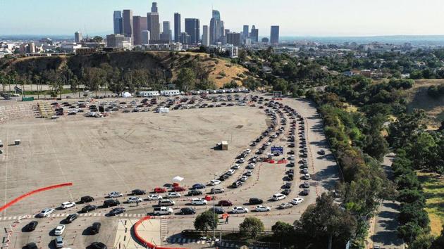 An aerial view of people in cars lined up to be tested for COVID-19 in a parking lot at Dodger Stadium on June 26 in Los Angeles, California. The United States accounts for over a quarter of all live lost to the pandemic since it was first reported to the WHO by Chinese authorities in late December 2019. (Mario Tama / Getty Images / AFP)