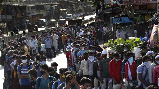 Migrant workers line up to board buses for their onward journey by train to their home states, at Dharavi, one of Asia's largest slums, in Mumbai, India.(AP/ File photo) Migrant workers line up to board buses for their onward journey by train to their home states, at Dharavi, one of Asia's largest slums, in Mumbai, India.(AP/ File photo)
