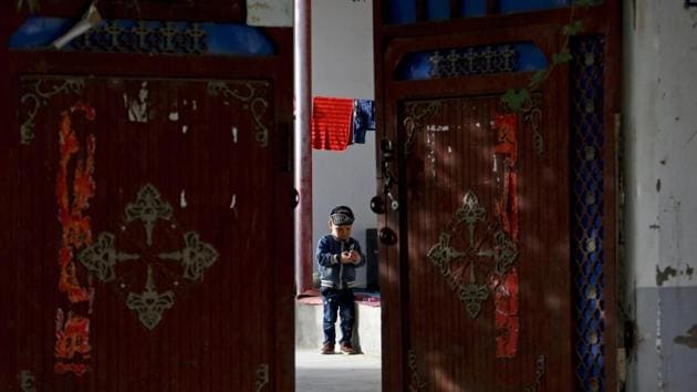 In this 2018 photo, a Uighur child plays alone in the courtyard of a home at the Unity New Village in Hotan, in western China's Xinjiang region. (AP photo) In this 2018 photo, a Uighur child plays alone in the courtyard of a home at the Unity New Village in Hotan, in western China's Xinjiang region. (AP photo)