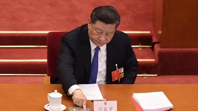 China's President Xi Jinping voting on a proposal to draft a security law on Hong Kong during the closing session of the National People's Congress at the Great Hall of the People in Beijing.(AFP photo)