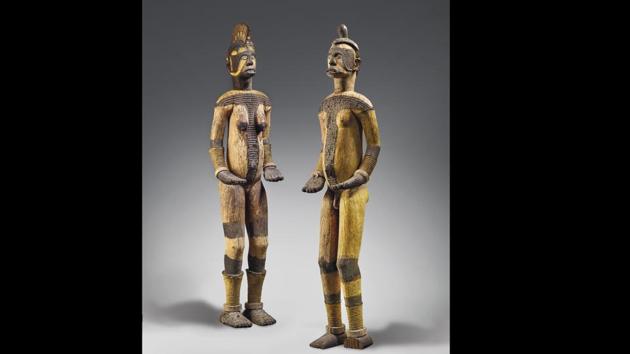 In this undated photo issued by Christie's auction house, two Igbo statues on display. The pair of sacred statues, that a Nigerian museum commission and protesters claimed were looted during the country's 1960s civil war fetched 212,500 euros ($239,000) at auction in Paris on Monday, June 29, 2020. Christie's auction house, which defended the sale and said the artworks were legitimately acquired. (Christie's via AP)(AP)
