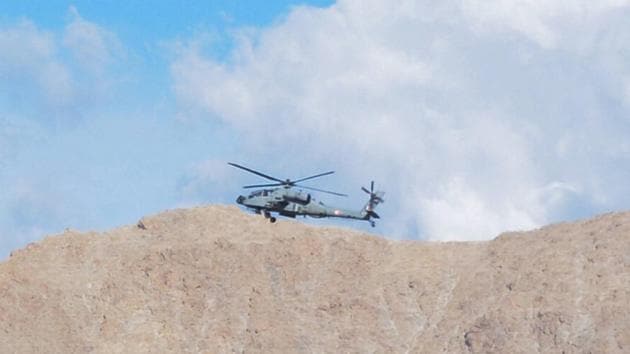 An IAF chopper flies in the skies above Leh in Ladakh on Monday. (PTI File Photo) An IAF chopper flies in the skies above Leh in Ladakh on Monday. (PTI File Photo)