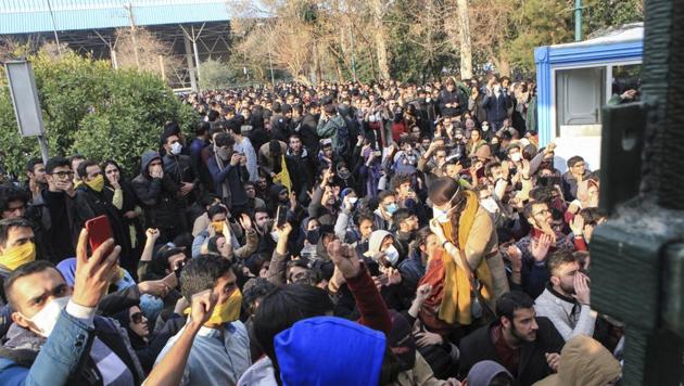 In this 2017 file photo , university students attend a protest inside Tehran University while anti-riot Iranian police prevent them to join other protestors, in Tehran, Iran.(AP)